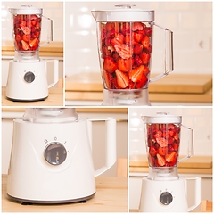 Image showing fresh strawberries in white Blender on a wooden table