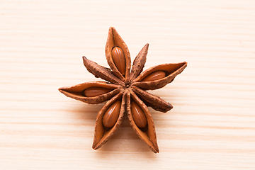 Image showing Organic star anise on a wooden table