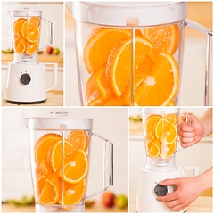 Image showing White blender with juicy oranges on a wooden table