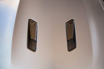 Image showing Closeup photo of grey car. 