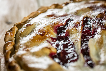 Image showing Berry pie with blueberries close-up on a plate on the table. horizontal