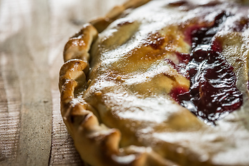 Image showing Berry pie with blueberries close-up on a plate on the table. horizontal