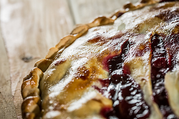 Image showing Berry pie with blueberries close-up on a plate on the table. horizontal