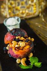 Image showing Grilled peaches with nuts and ice-cream