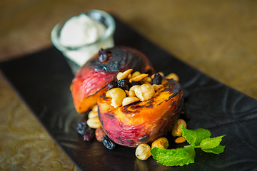 Image showing Grilled peaches with nuts and ice-cream