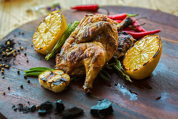 Image showing roasted chicken with lemon and herbs