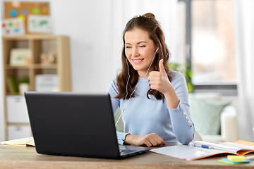 Image showing teacher with laptop having online class at home