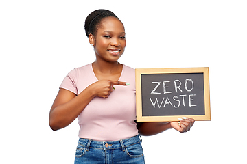 Image showing happy woman holds chalkboard with zero waste words