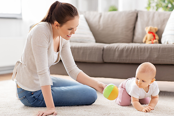 Image showing happy smiling mother with little baby at home