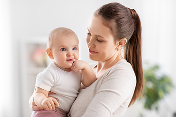 Image showing happy mother with little baby daughter at home