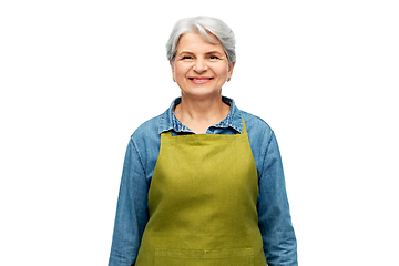 Image showing portrait of smiling senior woman in garden apron