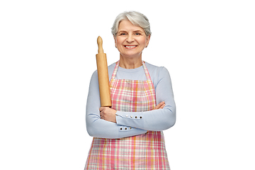 Image showing smiling senior woman in apron with rolling pin
