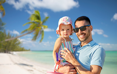 Image showing happy father with little daughter on beach