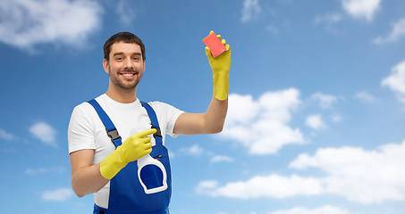 Image showing male cleaner cleaning with sponge and detergent