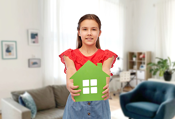 Image showing smiling little girl holding green house icon