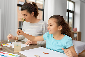 Image showing happy mother with little daughter drawing at home