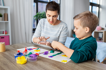 Image showing mother and son playing with modeling clay at home