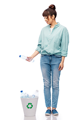 Image showing smiling young woman sorting plastic waste