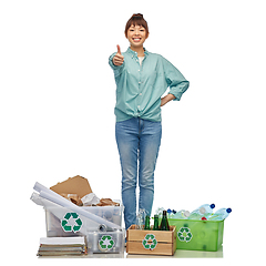 Image showing happy woman sorting paper, metal and plastic waste