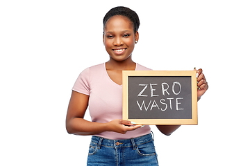 Image showing happy woman holds chalkboard with zero waste words