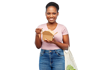 Image showing happy woman with reusable string bag eating wok