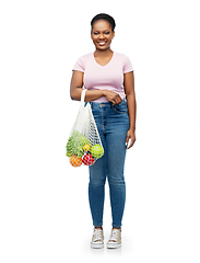 Image showing african woman with food in reusable string bag