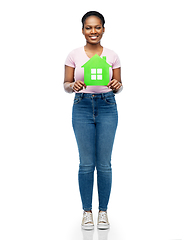 Image showing smiling african american woman holding green house