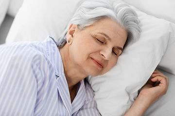 Image showing senior woman sleeping in bed at home bedroom