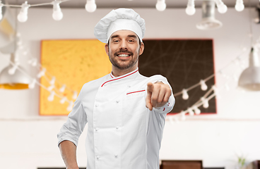 Image showing happy smiling male chef in toque pointing to you