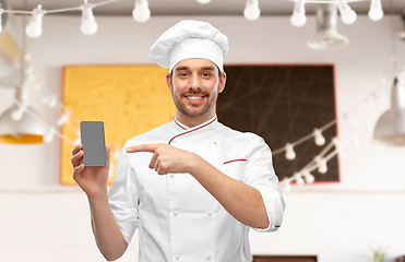 Image showing happy smiling male chef showing smartphone