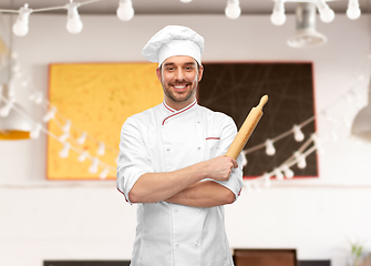 Image showing happy smiling male chef or baker with rolling pin