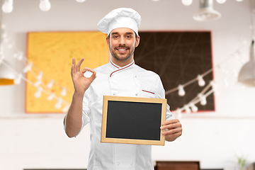 Image showing happy smiling male chef showing chalkboard