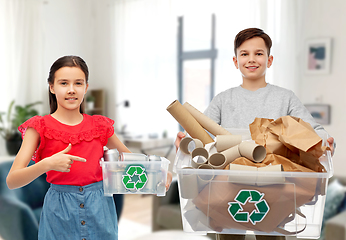 Image showing smiling girl and boy sorting paper and metal waste