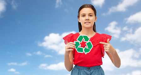 Image showing smiling girl holding green recycling sign