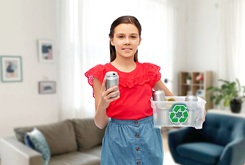 Image showing smiling girl sorting metallic waste at home