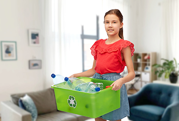 Image showing smiling girl sorting plastic waste at home