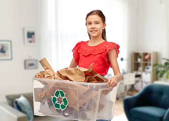 Image showing smiling girl sorting paper waste at home