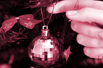 Image showing Christmas ornaments on tree.