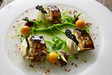 Image showing Grilled Foods. Grilled Fish with chanterelles with greens.