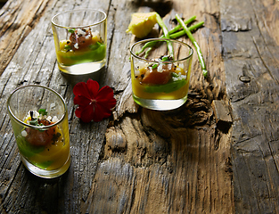 Image showing Snack from salmon and puree from avocado in a glass. Film effect