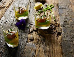 Image showing Snack from salmon and puree from avocado in a glass. Film effect