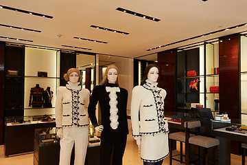 Image showing Three womans mannequins in luxury clothes shop.