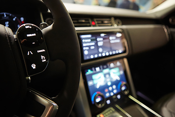 Image showing Modern car interior. Shallow DOF. Steering wheel in focus