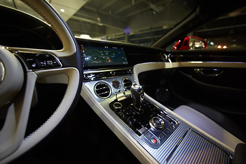 Image showing Car interior luxury. Interior of prestige modern car. Dashboard and steering wheel. Focus on steering wheel.