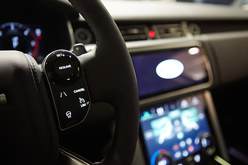 Image showing Modern car interior. Shallow DOF. Steering wheel in focus