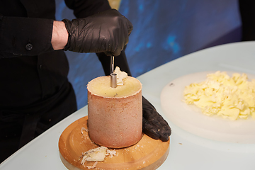 Image showing Special cheese knives. The girolle scraper. Making cheese shavin