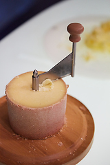 Image showing Swiss cheese Tete de Moine with a Girolle.