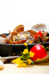 Image showing fresh clams on an iron skillet