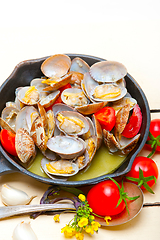 Image showing fresh clams on an iron skillet