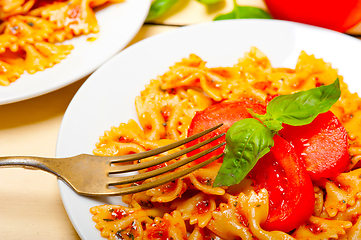 Image showing Italian pasta farfalle butterfly bow-tie and tomato sauce